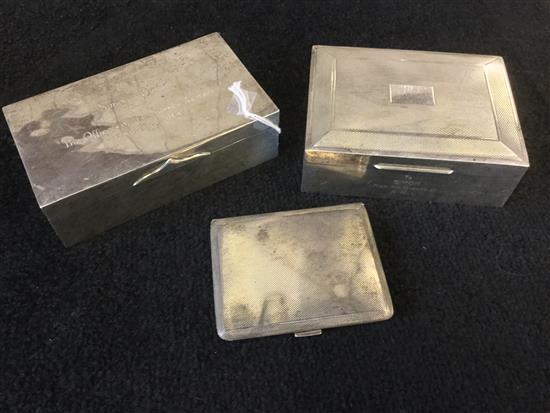 Two silver cigarette boxes and a cigarette case